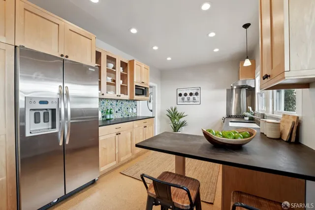 a bathroom with a toilet a sink and shower