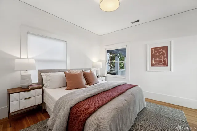 a bedroom with bed and a window