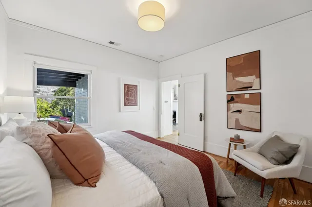 a front view of a house with plants