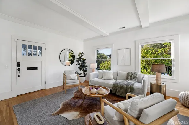 a living room with furniture and a window