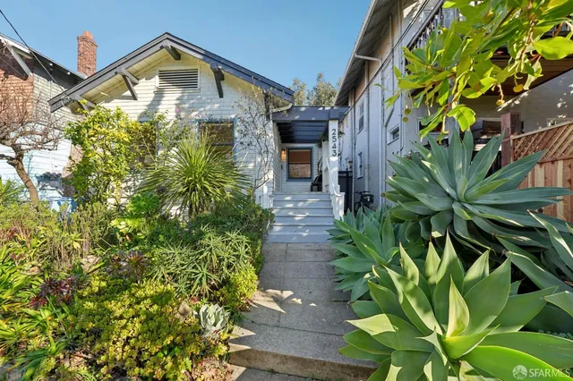 a view of a wooden bench next to a road