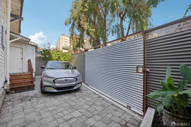 a group of people sitting in front of a building