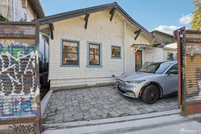 an entrance view with a garden and stairs
