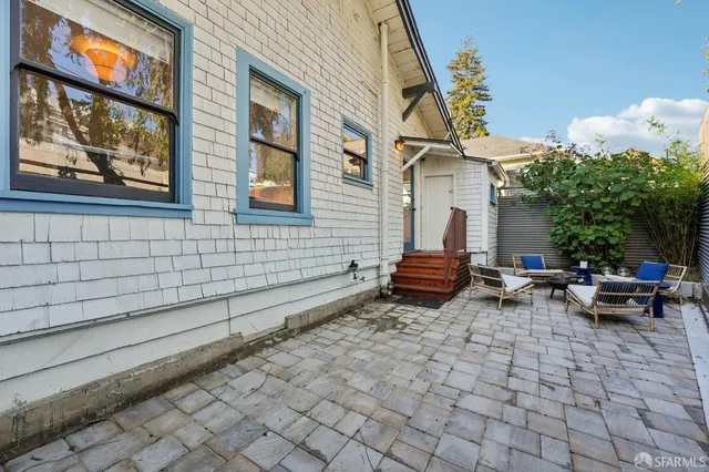 a view of a chairs and tables in the balcony