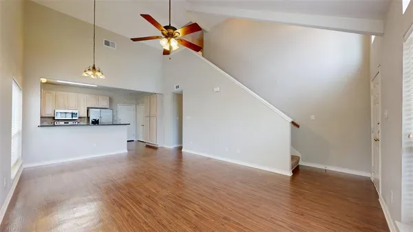 a view of a kitchen with a sink and a window