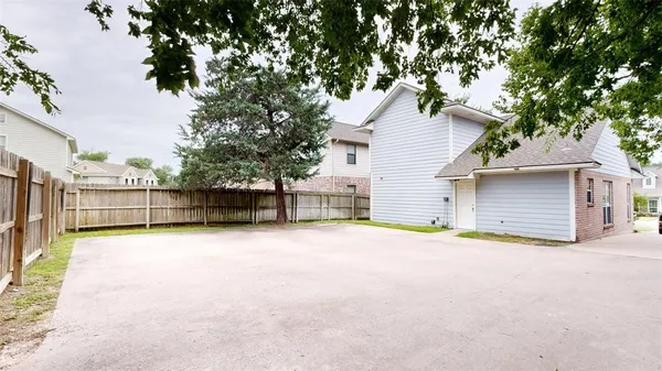 a backyard of a house with garage