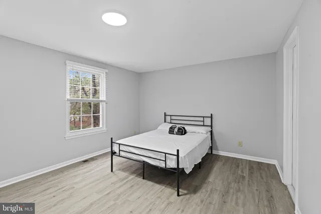 a room with a bed and a window