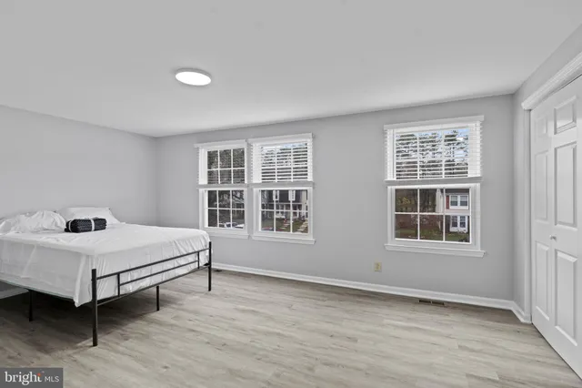 a room with a bed and a window