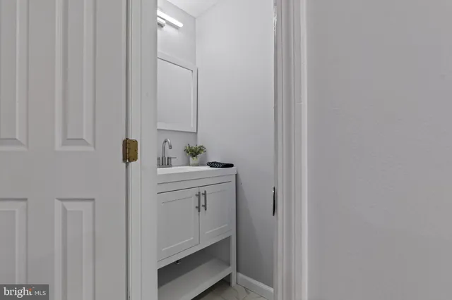 a bathroom with a sink and mirror