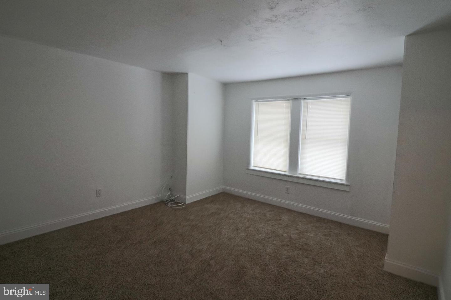506 Ridgeway Street Gloucester City, NJ 08030 - Photo 6 of 10 an empty room with a window