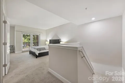 a spacious bedroom with a bed and a table