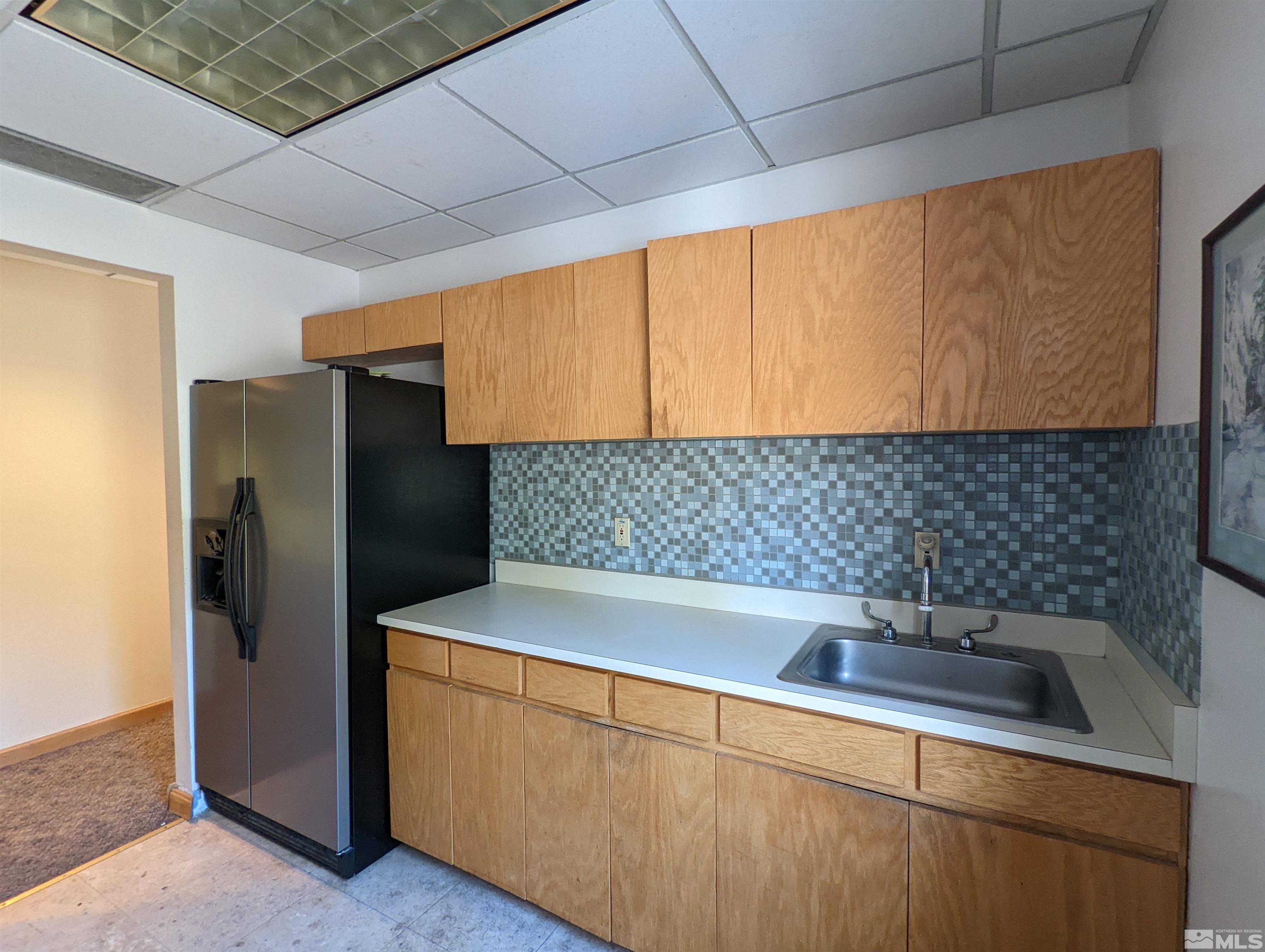 889 Alder Avenue, Unit 301 Incline Village, NV 89451 - Photo 15 of 23 a kitchen with stainless steel appliances a sink and a refrigerator