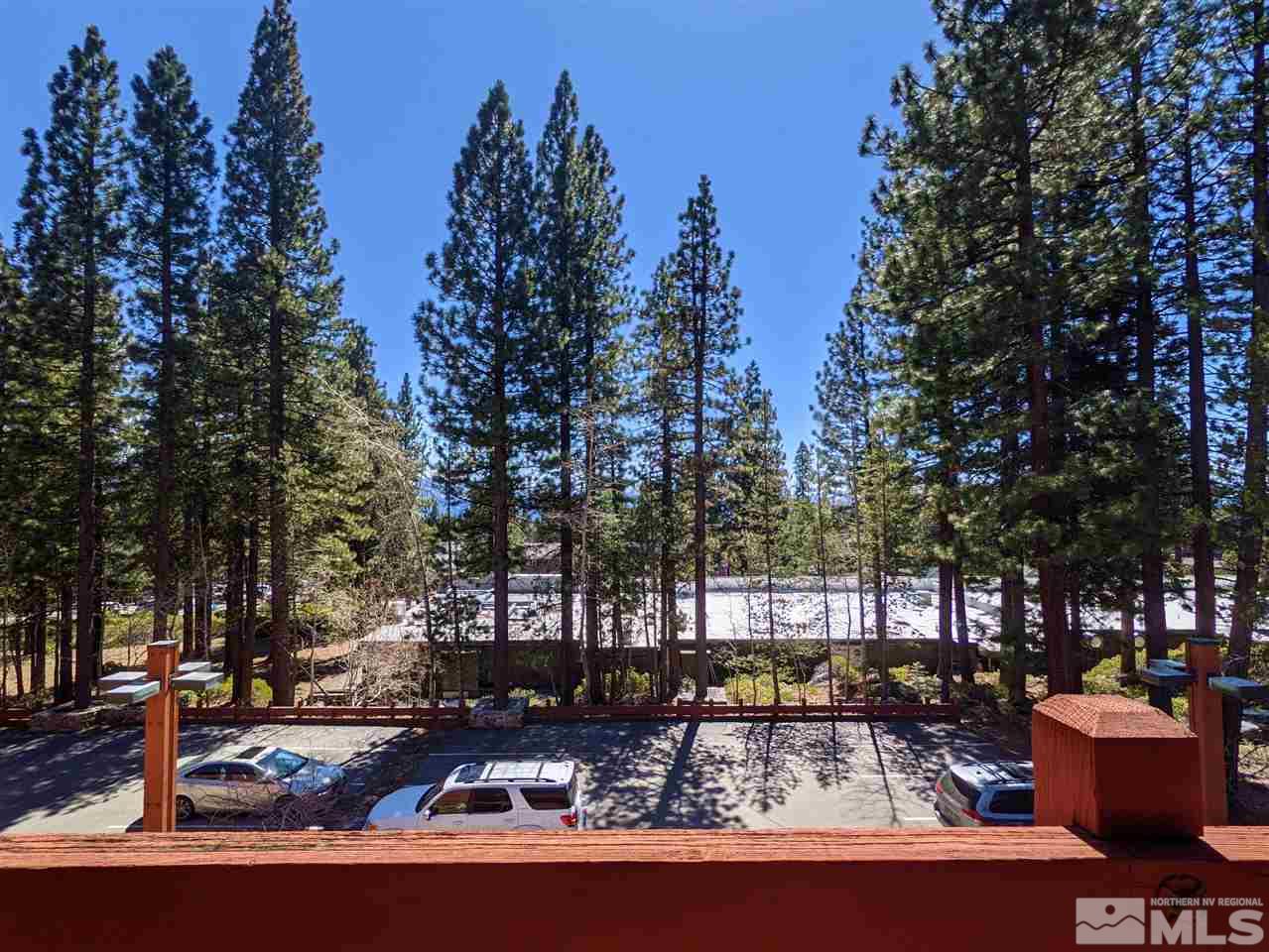 889 Alder Avenue, Unit 301 Incline Village, NV 89451 - Photo 8 of 23 a swimming pool with outdoor seating and trees in the background