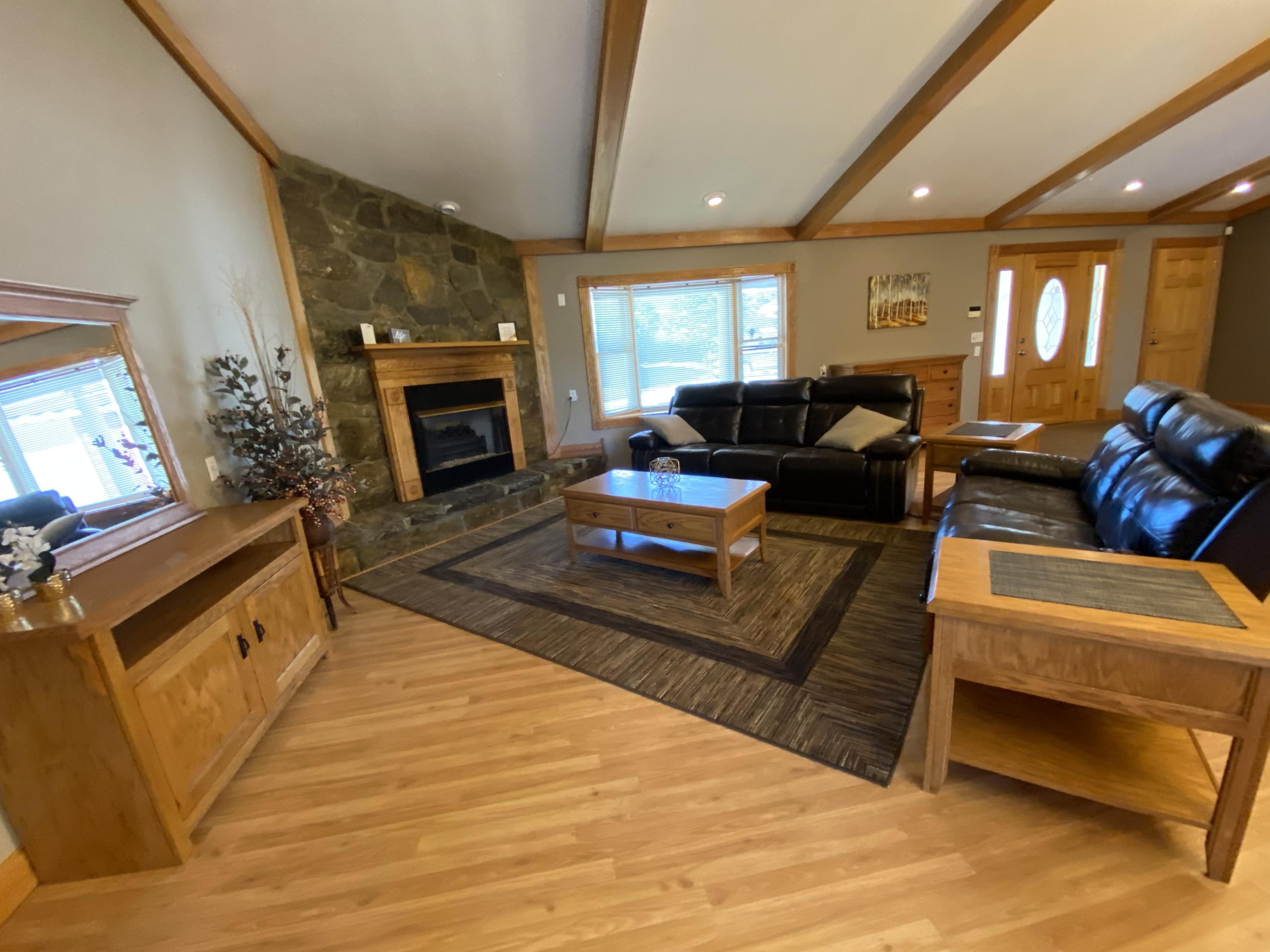 337 Under Pass Road Ewing, VA 24248 - Photo 19 of 33 living room with stone gas log fireplace