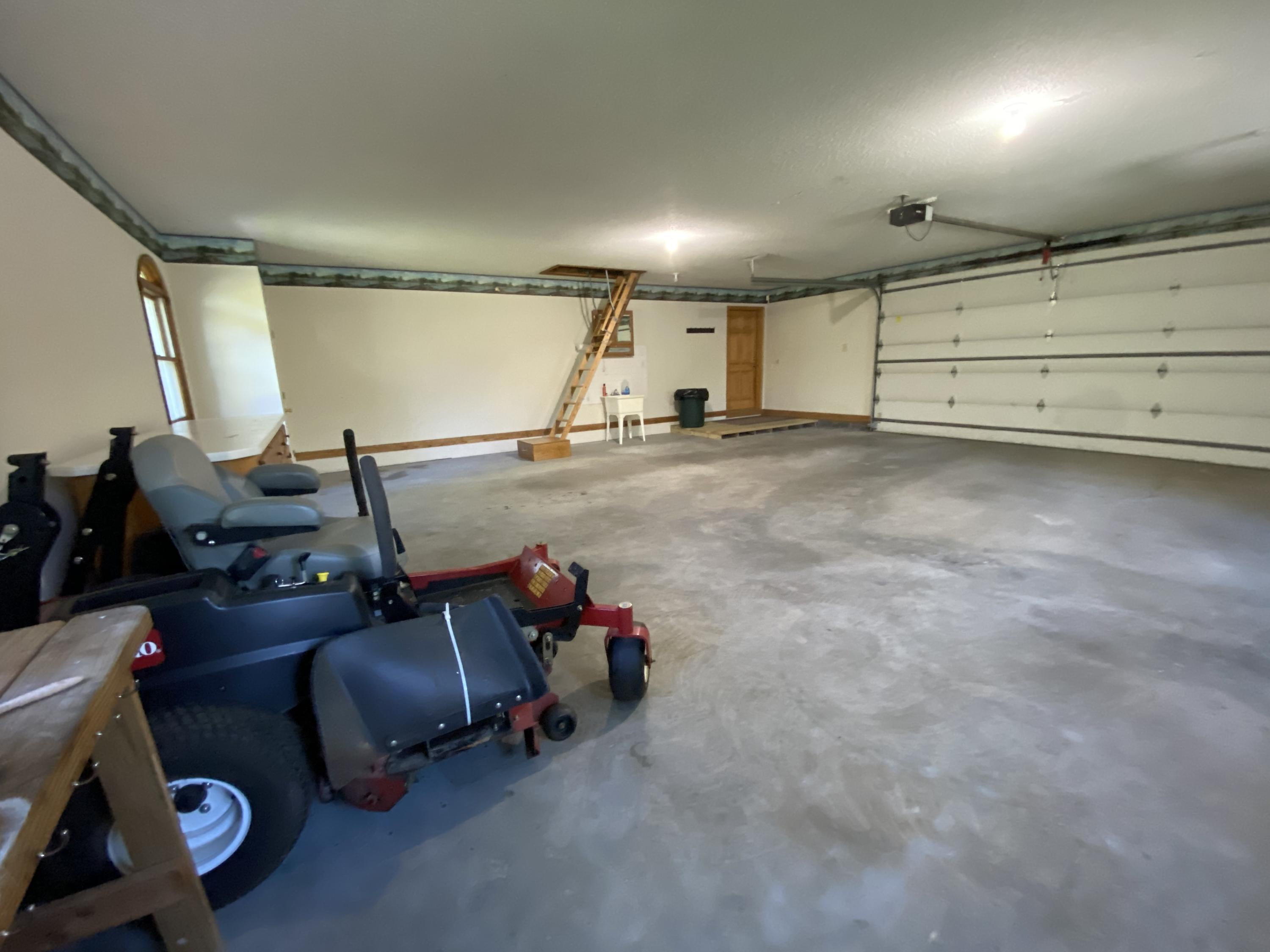 337 Under Pass Road Ewing, VA 24248 - Photo 32 of 33 2 car garage with ladder to attic and ha