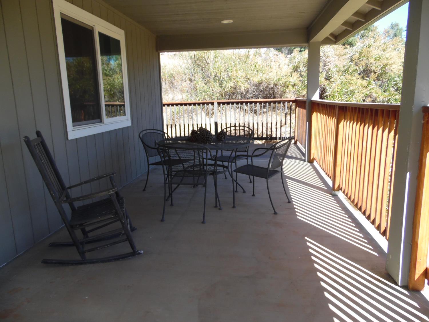 10006 Wendell Road Mountain Ranch, CA 95246 - Photo 17 of 37 a view of a porch with chairs and backyard
