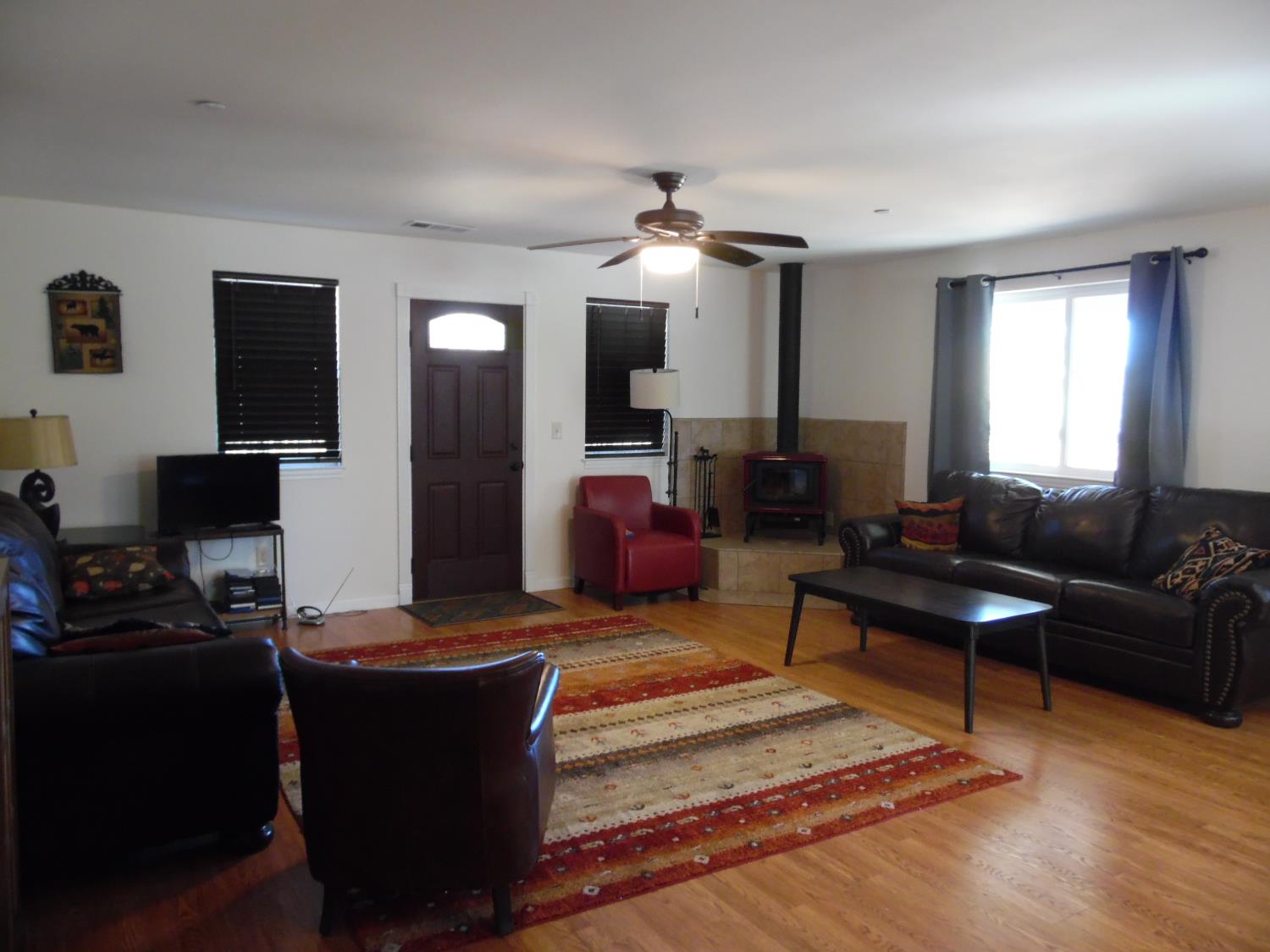 10006 Wendell Road Mountain Ranch, CA 95246 - Photo 21 of 37 a living room with furniture and wooden floor