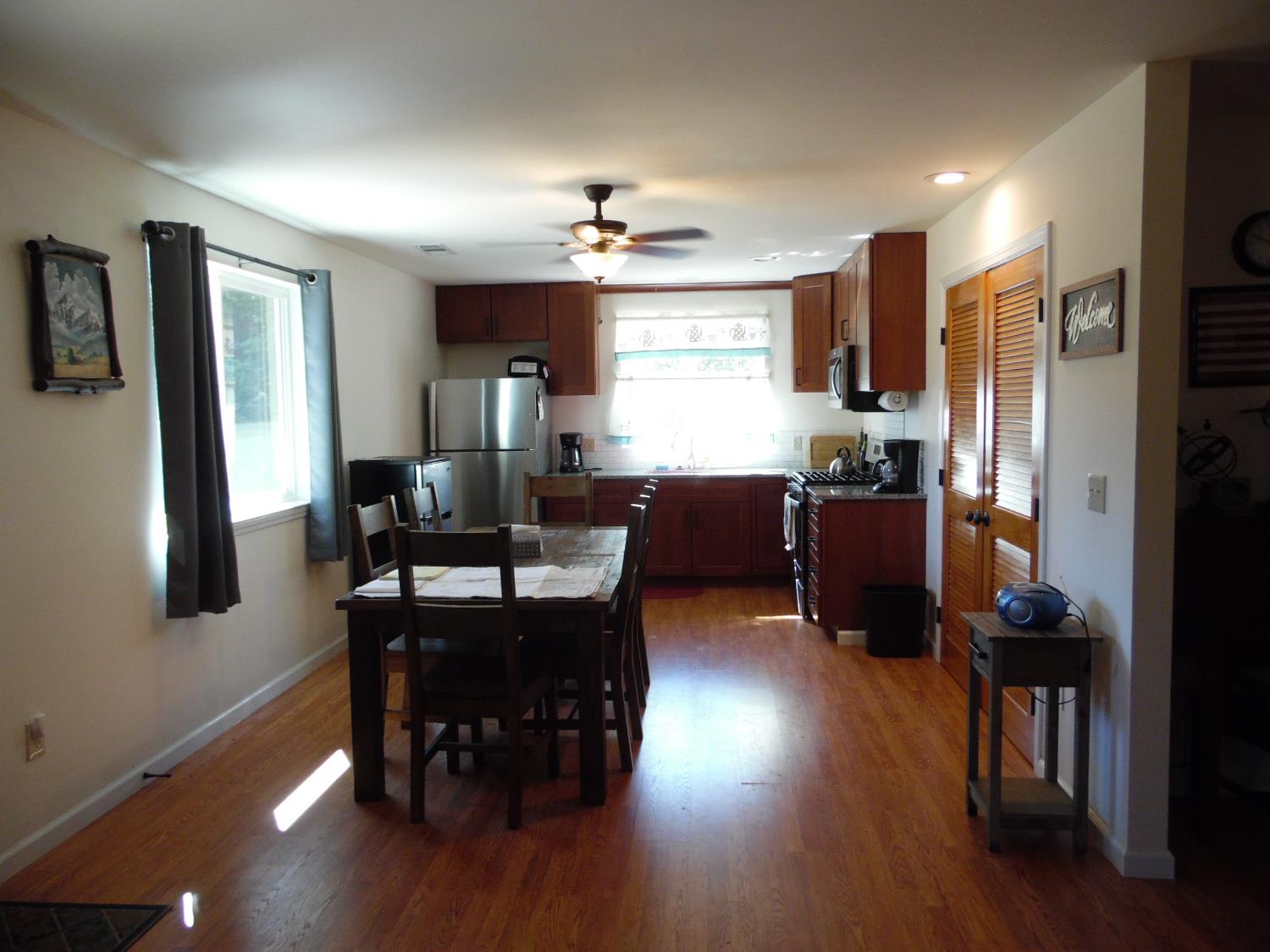 10006 Wendell Road Mountain Ranch, CA 95246 - Photo 23 of 37 a view of a dining room with furniture window and wooden floor