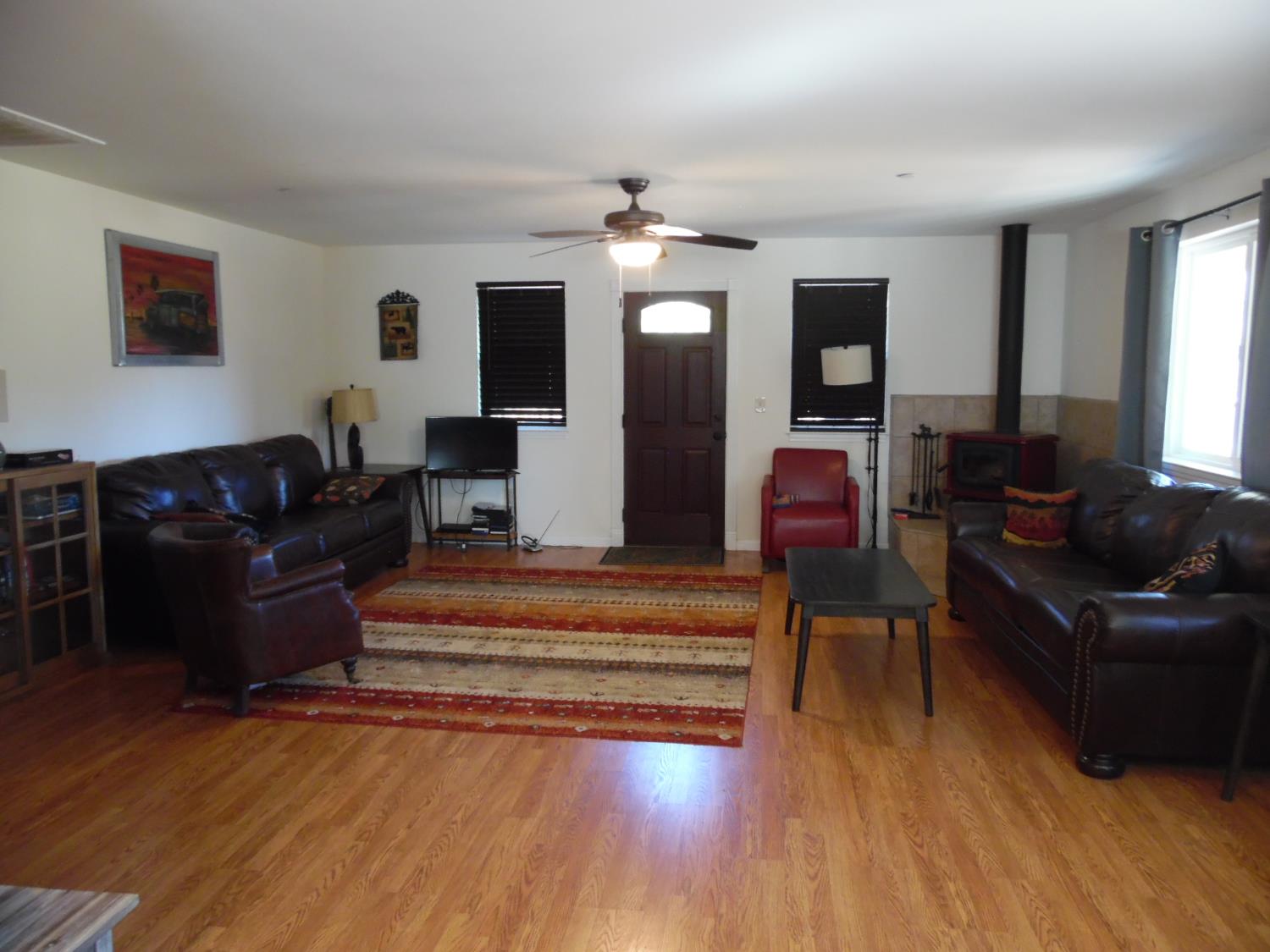 10006 Wendell Road Mountain Ranch, CA 95246 - Photo 26 of 37 a living room with furniture chandelier and wooden floor