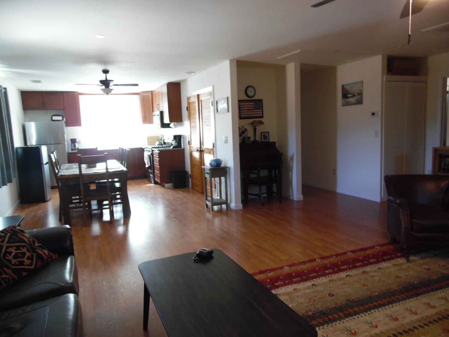 10006 Wendell Road Mountain Ranch, CA 95246 - Photo 34 of 37 a living room with dining room and wooden floor