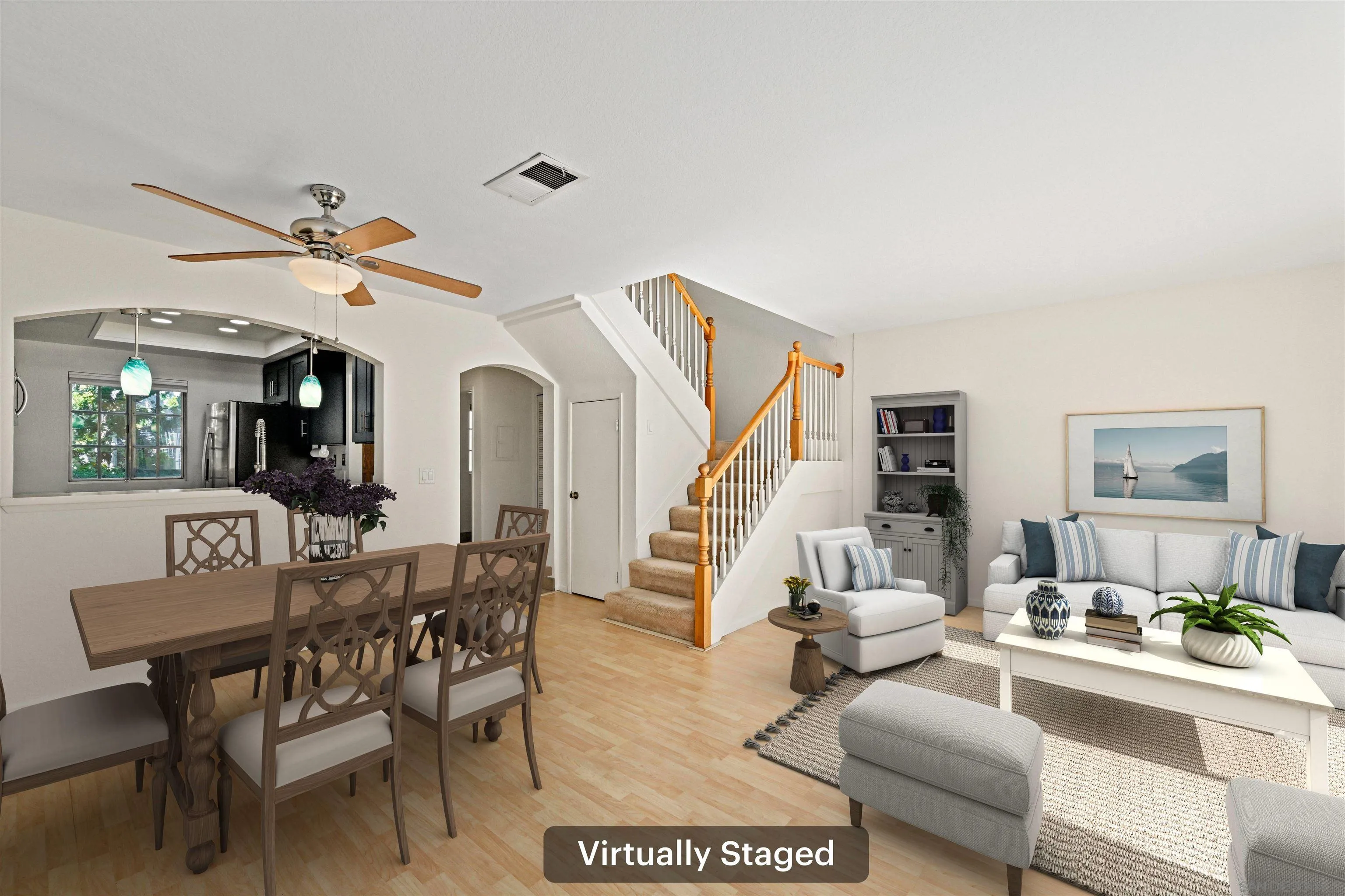 a living room with furniture a fireplace and a chandelier