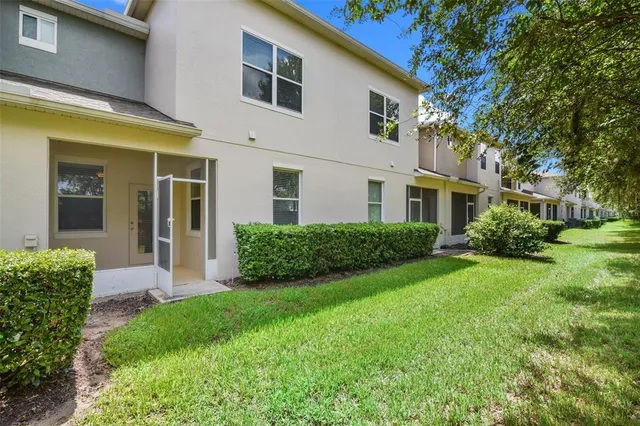 a view of an house with backyard space and garden