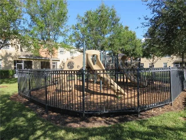 a view of a wrought iron fences in front of house