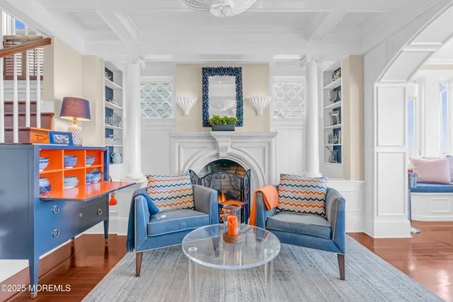 a living room filled with furniture and a window