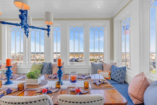 a bedroom with a large bed and a flat tv screen