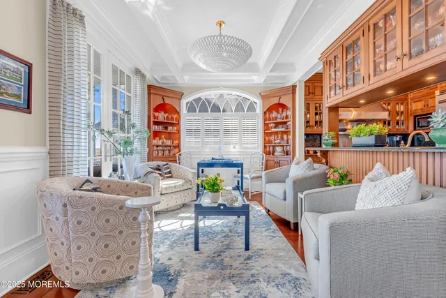 a view of a hallway with wooden floor and entryway