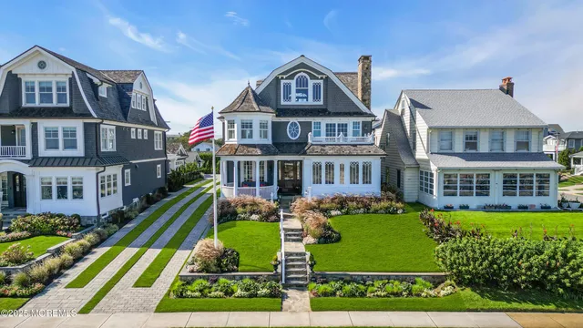 a front view of a house with a yard table and chairs
