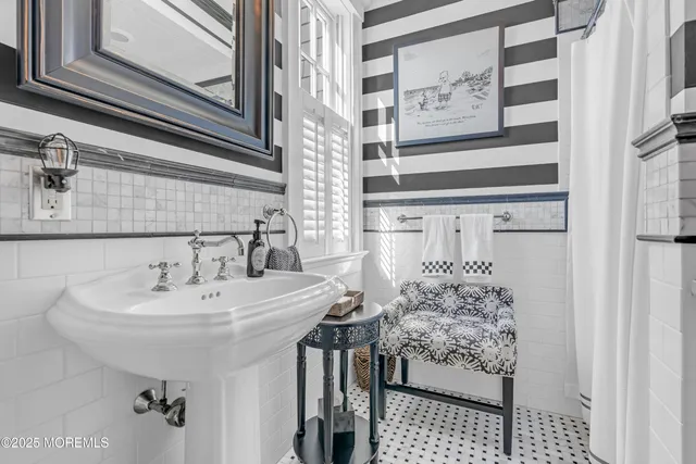 a front view of a house with a yard and fountain in middle