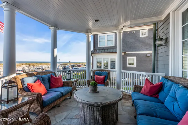 a living room with furniture and a book shelf