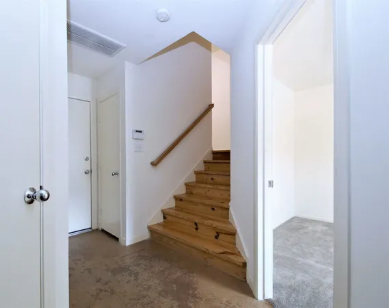 a view of a hallway with staircase