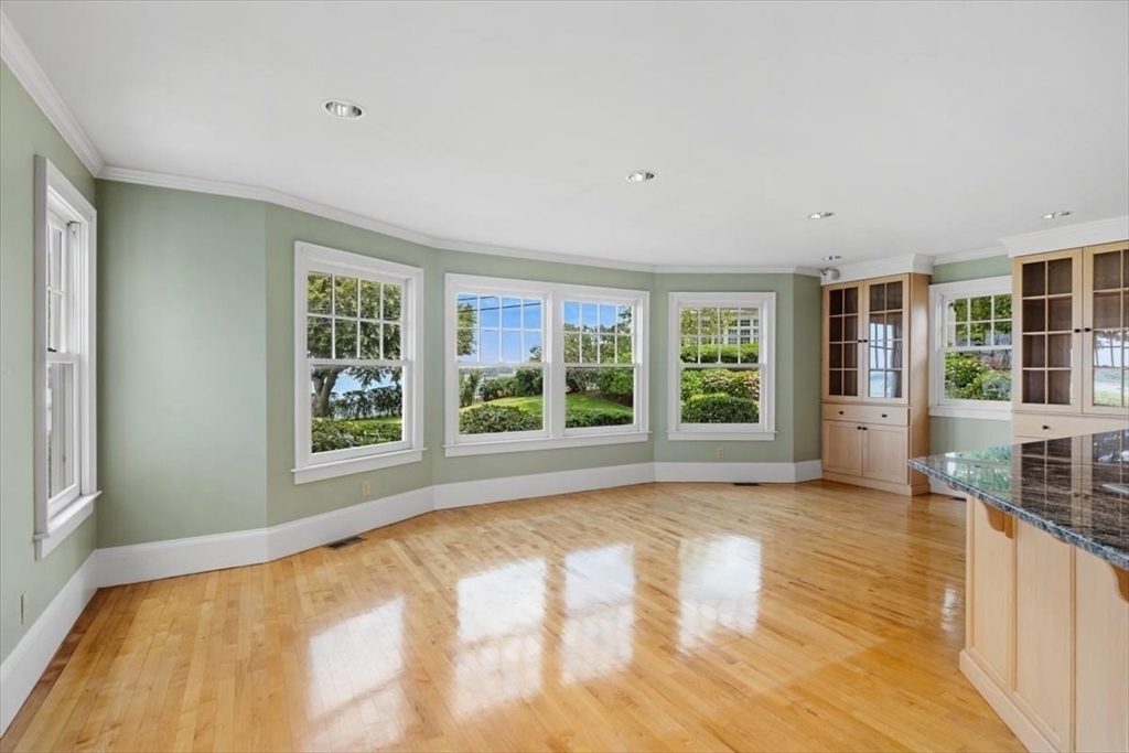 26 Bel Air Road Hingham, MA 02043 - Photo 14 of 41 a view of empty room with wooden floor and fan