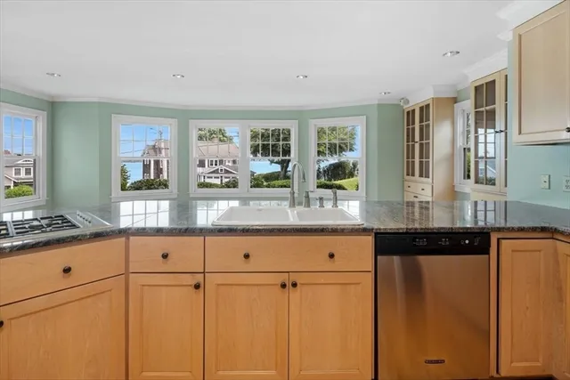 a spacious bathroom with a granite countertop sink mirror and window