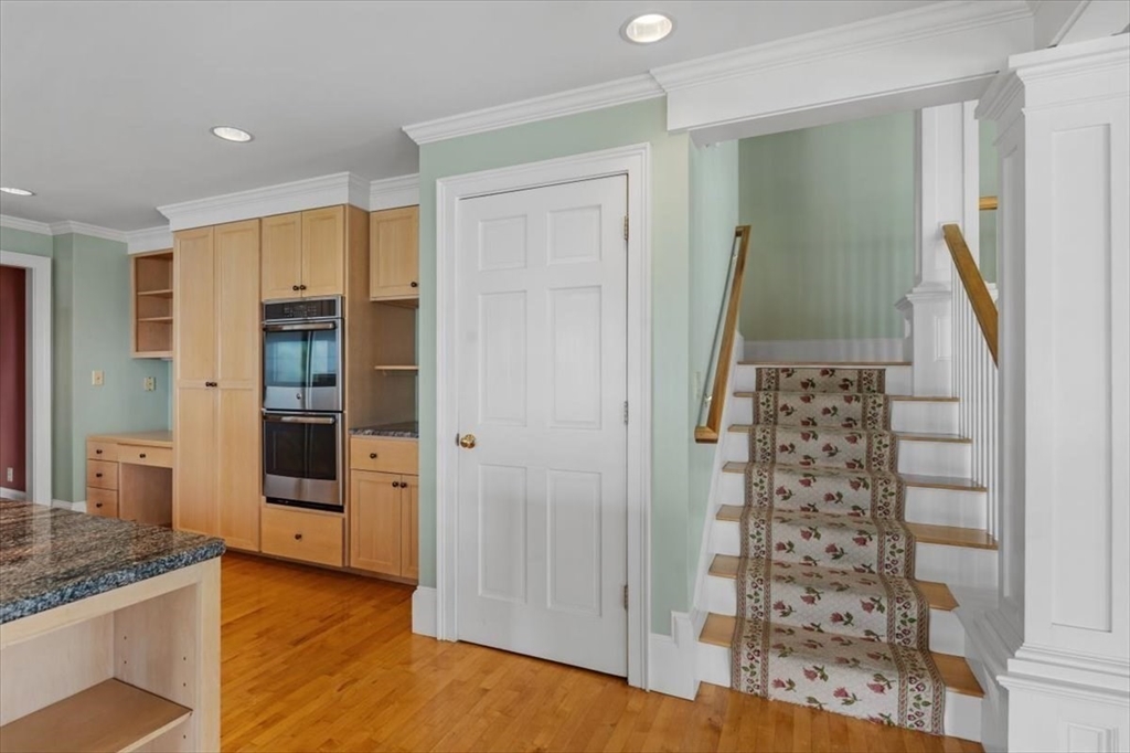 26 Bel Air Road Hingham, MA 02043 - Photo 17 of 41 a view of a kitchen with fridge and wooden floor