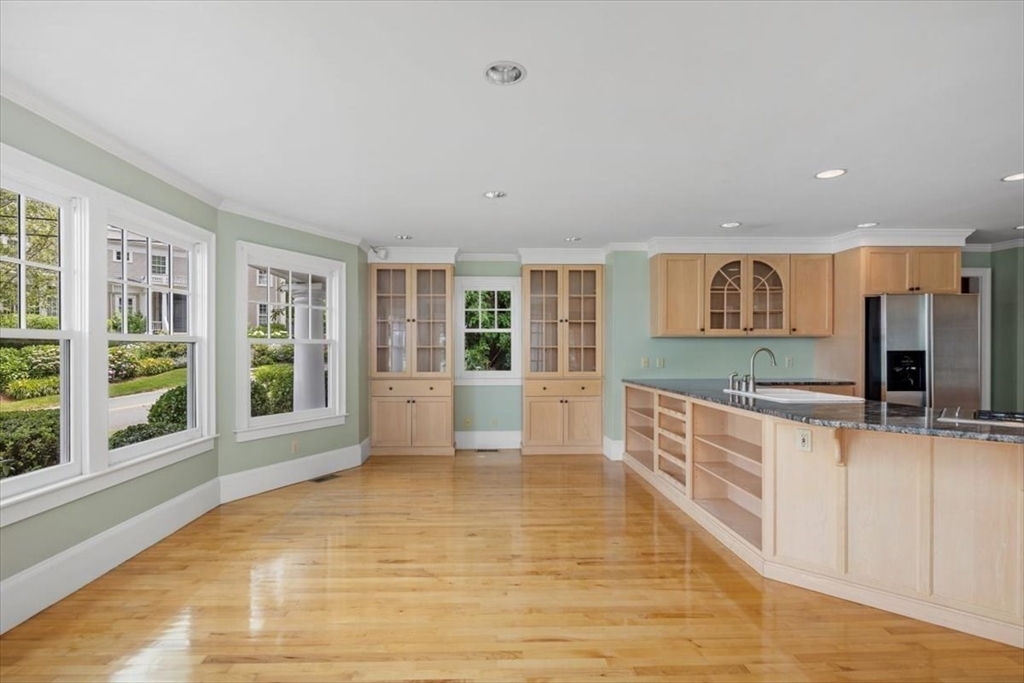26 Bel Air Road Hingham, MA 02043 - Photo 20 of 41 a large kitchen with stainless steel appliances a large counter top and a wooden floors