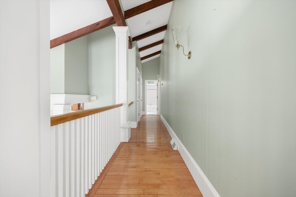 26 Bel Air Road Hingham, MA 02043 - Photo 21 of 41 a view of a hallway with wooden floor and staircase