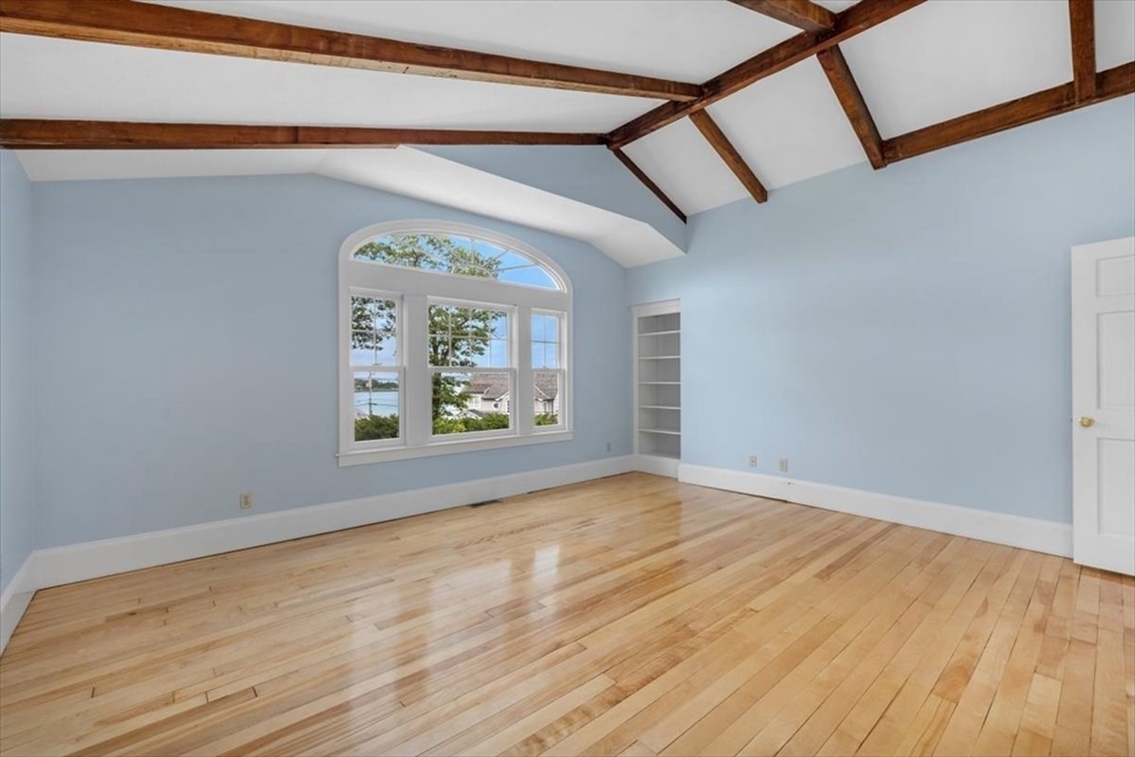 26 Bel Air Road Hingham, MA 02043 - Photo 23 of 41 a view of an empty room with a window and wooden floor