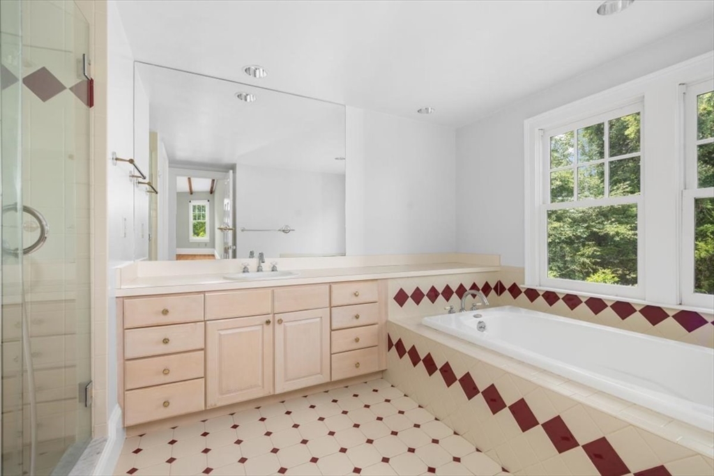 26 Bel Air Road Hingham, MA 02043 - Photo 25 of 41 a bathroom with a bathtub and a sink