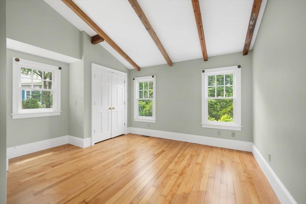 26 Bel Air Road Hingham, MA 02043 - Photo 27 of 41 an empty room with wooden floor and windows