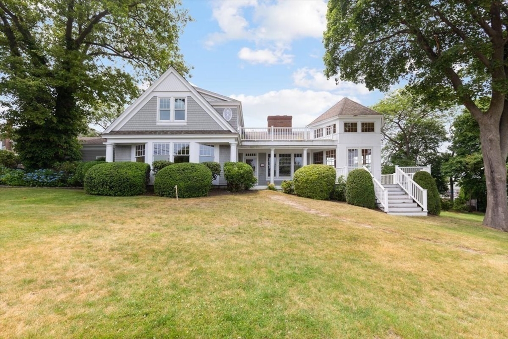 26 Bel Air Road Hingham, MA 02043 - Photo 4 of 41 a front view of a house with a garden