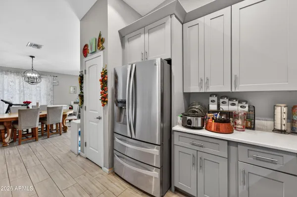 a kitchen with stainless steel appliances granite countertop a sink and cabinets