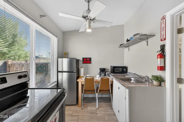 a view of a dining room with furniture wooden floor and a chandelier
