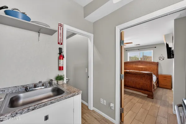 a bedroom with a bed and a ceiling fan