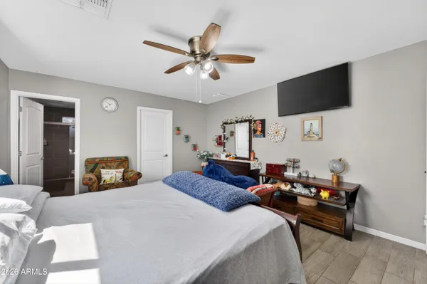 a bed room with a bed window and a couch