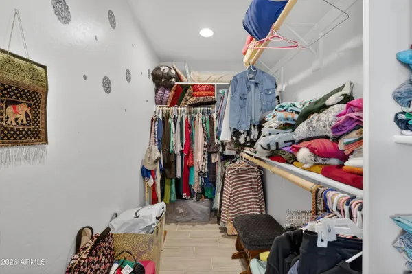 a bathroom with a toilet sink vanity and mirror