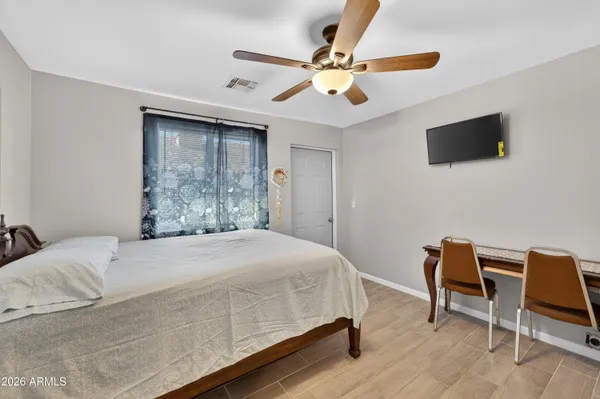 a bed room with a bed and furniture