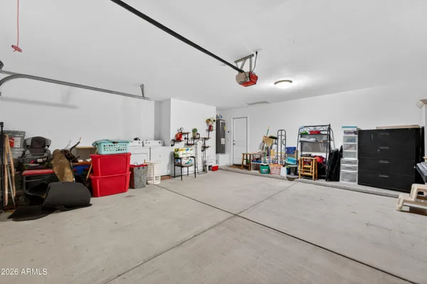 a view of a patio with a table and chairs